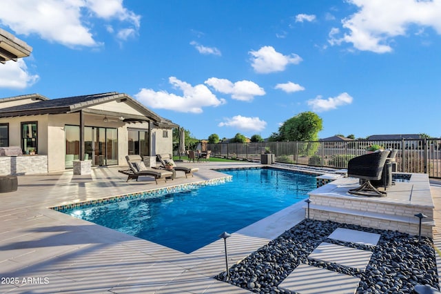 view of swimming pool with a patio, fence, and a fenced in pool