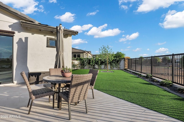 view of patio / terrace featuring a fenced backyard and outdoor dining space