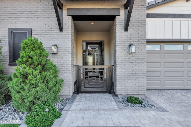doorway to property featuring an attached garage