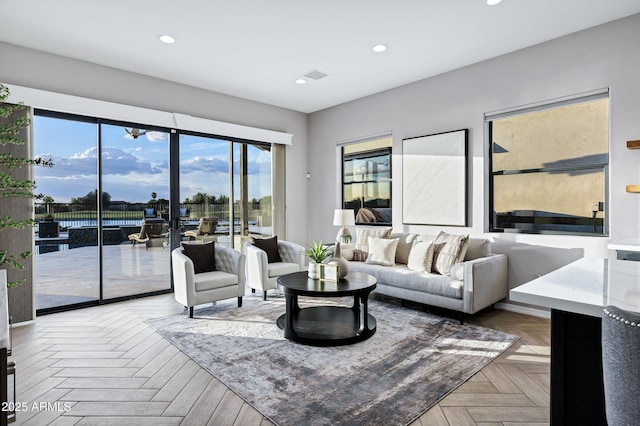 living room with recessed lighting and visible vents