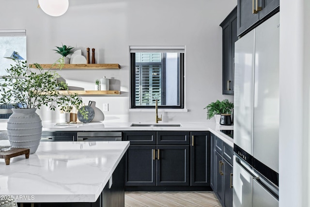 bar featuring black electric stovetop, stainless steel refrigerator, a sink, and dishwasher
