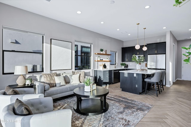 living room with baseboards and recessed lighting