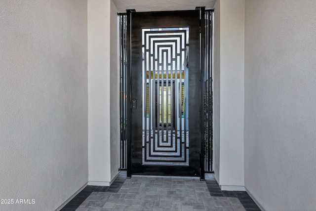 property entrance featuring stucco siding