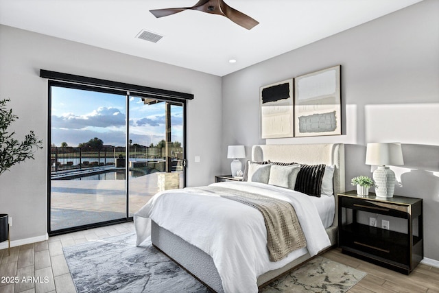 bedroom with access to outside, baseboards, visible vents, and light wood-type flooring