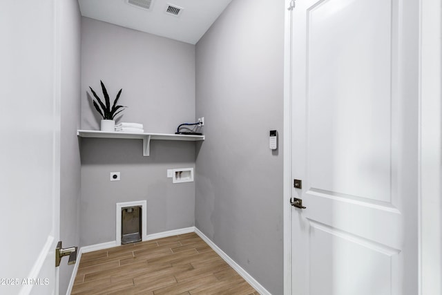 laundry room featuring laundry area, light wood-style floors, hookup for a washing machine, baseboards, and hookup for an electric dryer