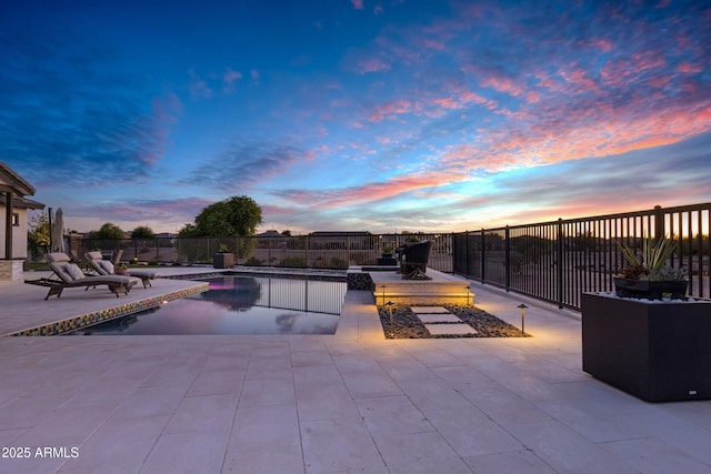 view of pool featuring a fenced in pool, a fenced backyard, and a patio area