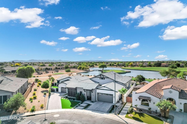 bird's eye view featuring a residential view and a water view
