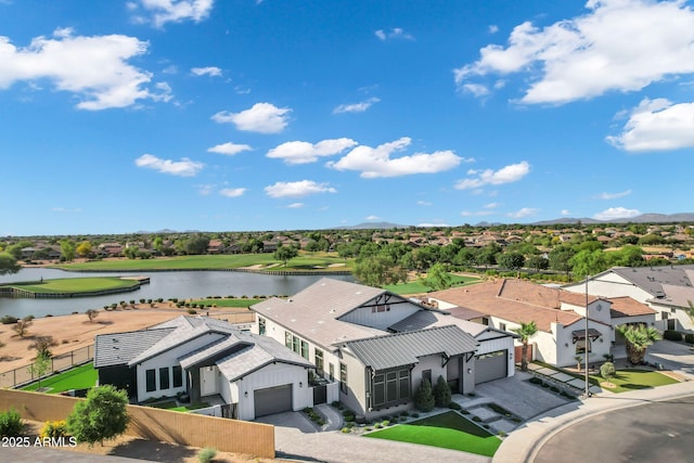 bird's eye view with a water view and a residential view