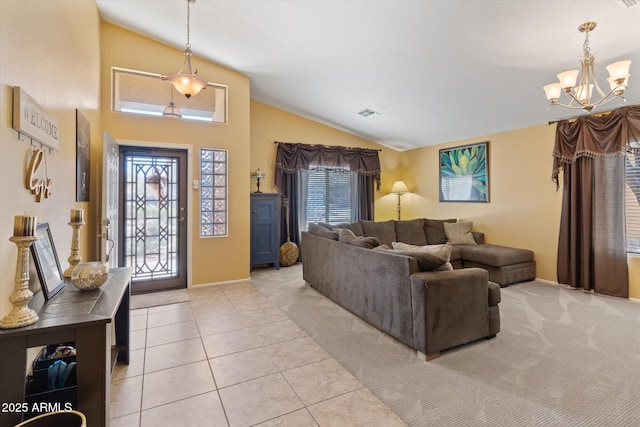 tiled living room with an inviting chandelier and vaulted ceiling