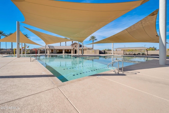 view of swimming pool with a patio area