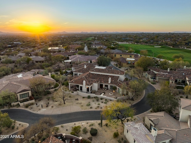 aerial view at dusk featuring a residential view