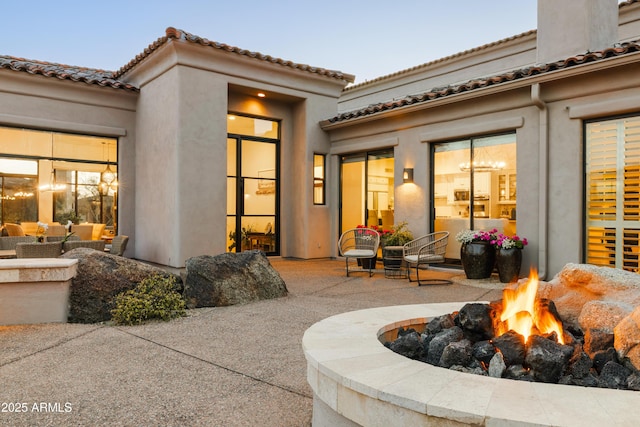 view of patio / terrace featuring an outdoor fire pit