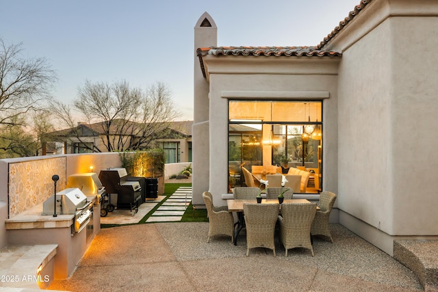 view of patio / terrace featuring outdoor dining space, grilling area, an outdoor kitchen, and an outdoor living space