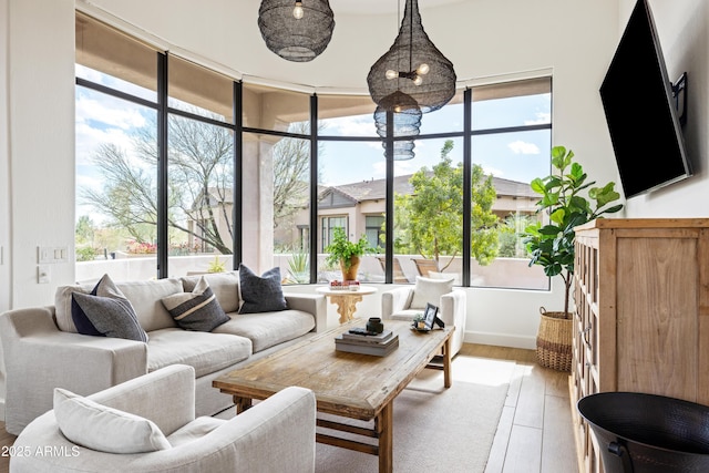 sunroom / solarium featuring a wealth of natural light