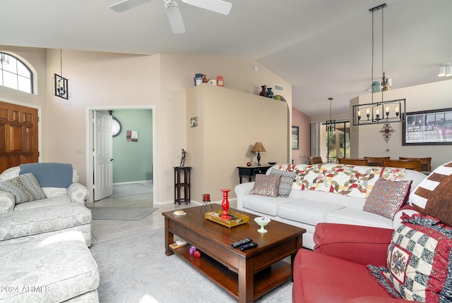 living room with ceiling fan, light tile patterned flooring, and high vaulted ceiling