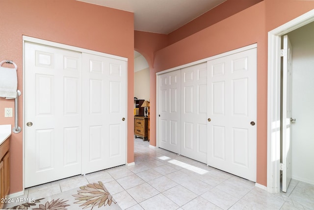 unfurnished bedroom featuring light tile patterned floors