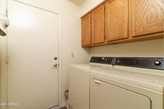 laundry area featuring cabinets and separate washer and dryer