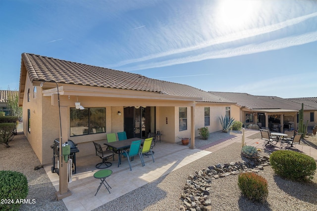 rear view of house with a patio