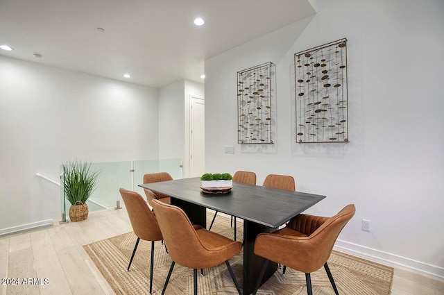 dining space featuring recessed lighting, wood finished floors, and baseboards