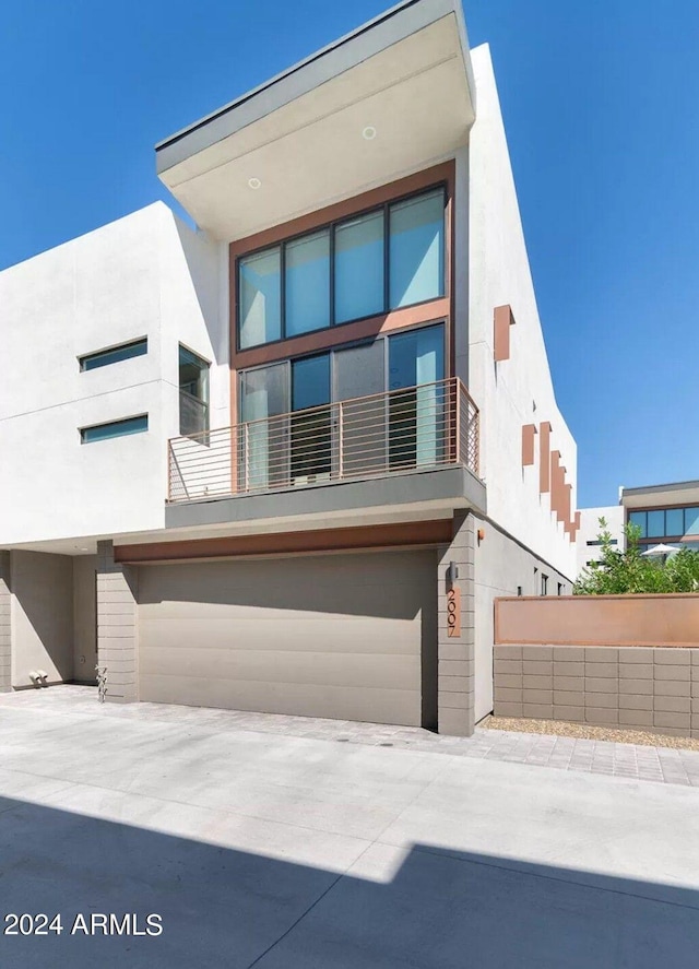 contemporary house featuring stucco siding and an attached garage