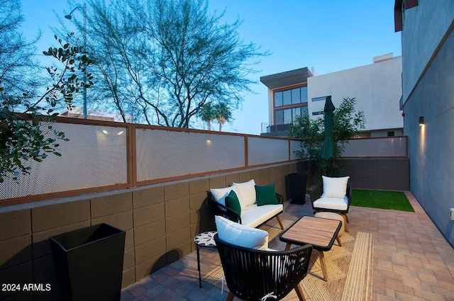 view of patio / terrace with outdoor lounge area and fence