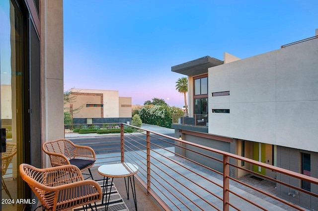 view of balcony at dusk