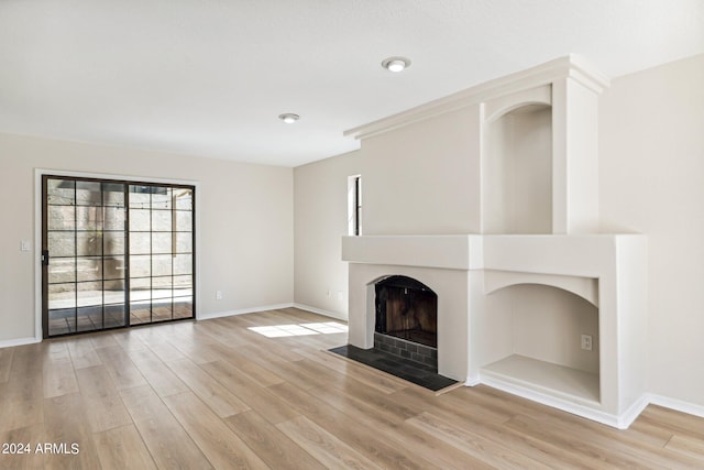 unfurnished living room featuring light hardwood / wood-style floors