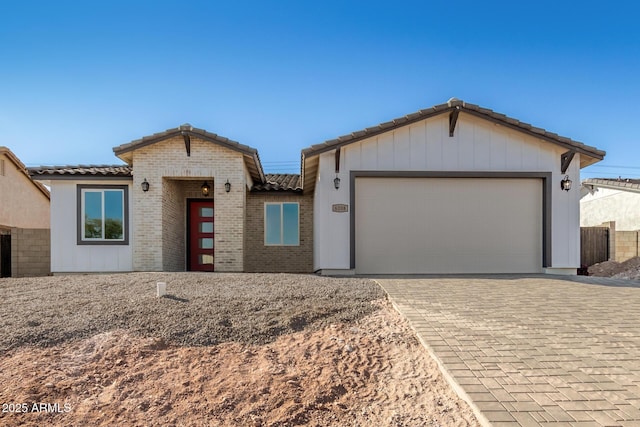 view of front of property with a garage