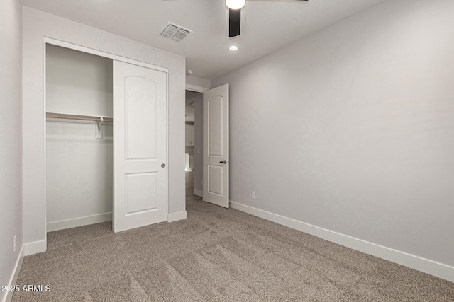 unfurnished bedroom with ceiling fan, a closet, and carpet flooring