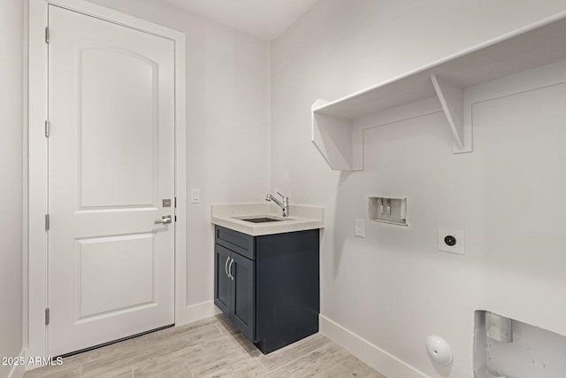 laundry area featuring sink, hookup for a washing machine, hookup for a gas dryer, and hookup for an electric dryer