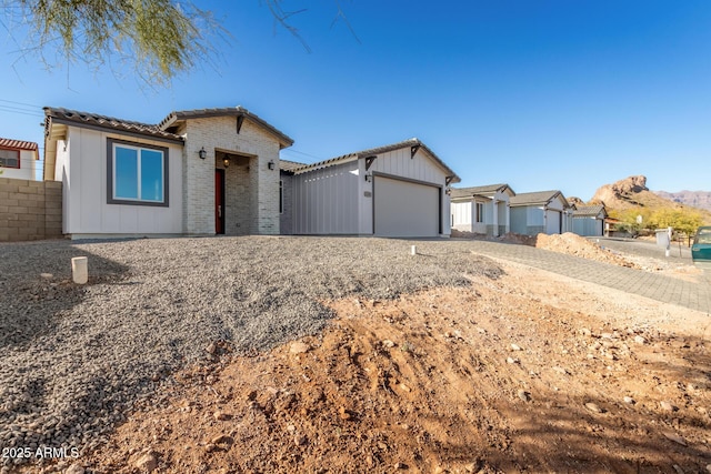 single story home featuring a garage