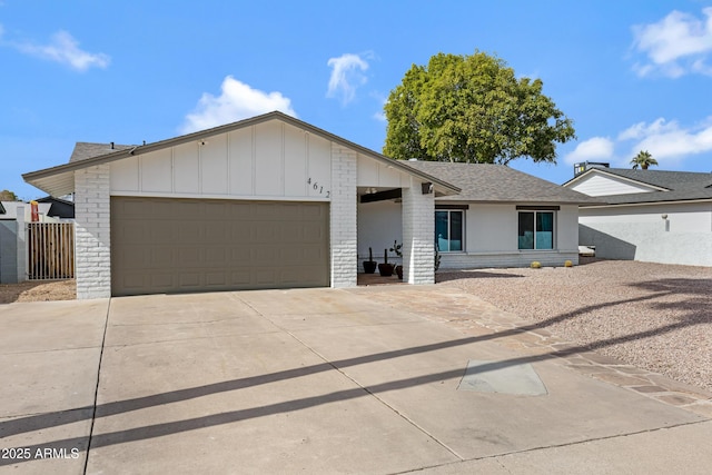 ranch-style home featuring a garage