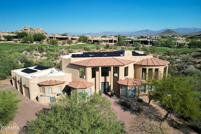 birds eye view of property with a mountain view