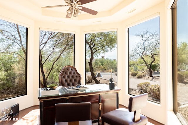 sunroom with a wealth of natural light and ceiling fan