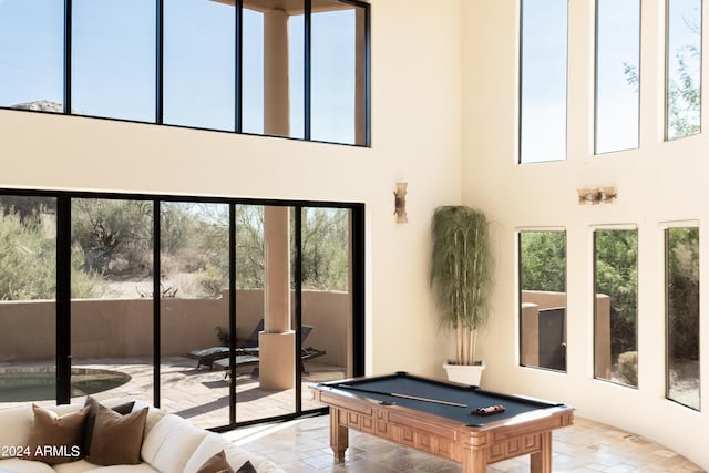 interior space featuring a high ceiling and billiards