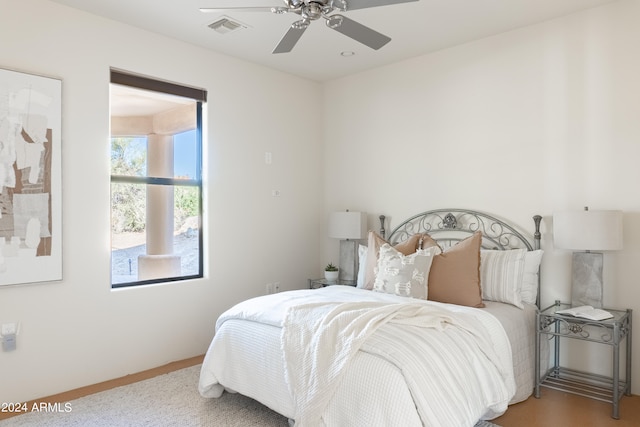 bedroom featuring wood-type flooring and ceiling fan