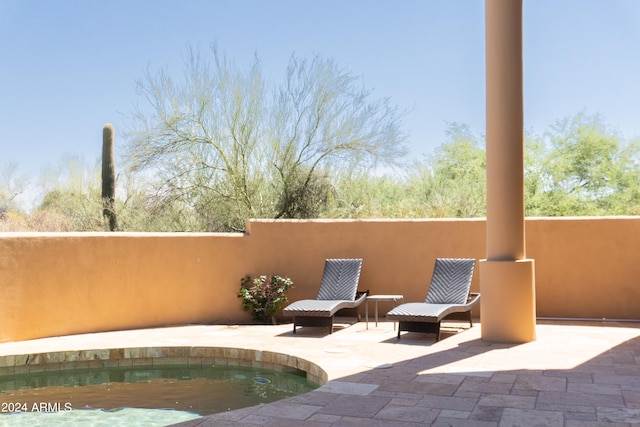 view of patio / terrace with a pool