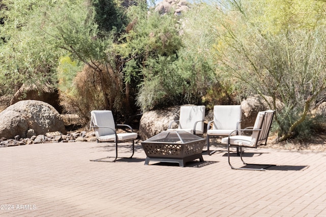 view of patio / terrace featuring an outdoor fire pit