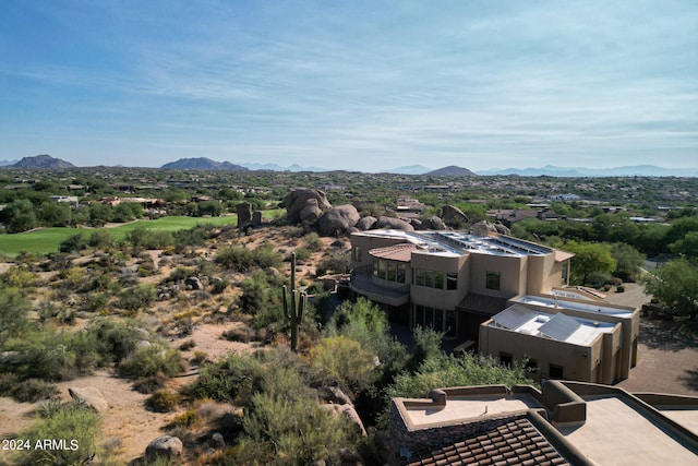 birds eye view of property featuring a mountain view