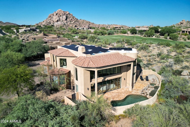 birds eye view of property featuring a mountain view