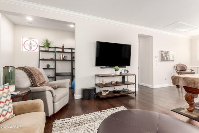 living area featuring visible vents, ornamental molding, baseboards, and wood finished floors