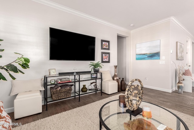 living area with wood finished floors, baseboards, and ornamental molding