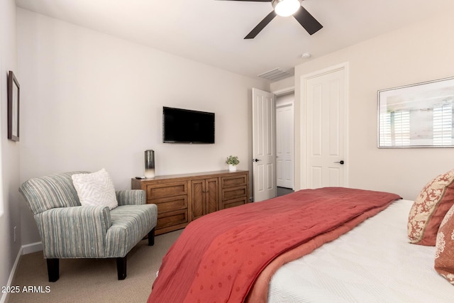 bedroom with visible vents, a ceiling fan, and carpet flooring