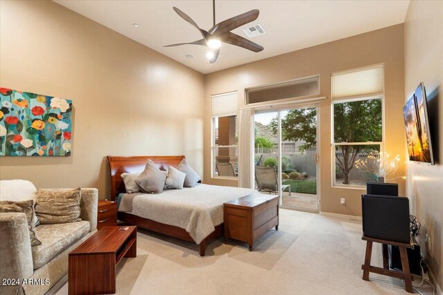 carpeted bedroom featuring ceiling fan and access to exterior