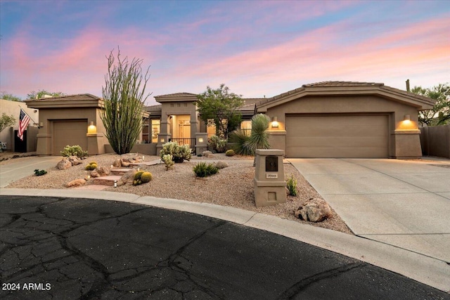 prairie-style home featuring a garage