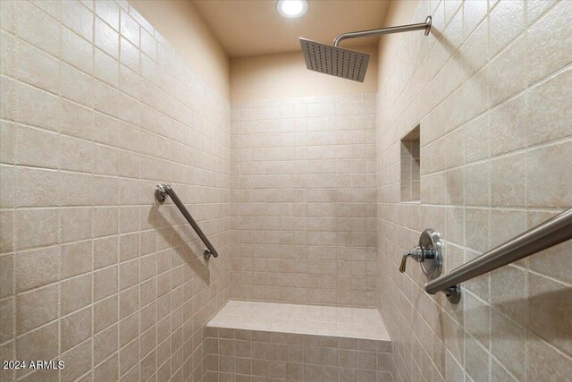 bathroom with tiled shower