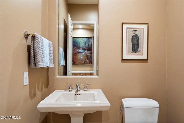 bathroom with toilet and sink