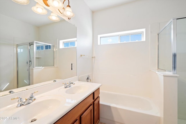 bathroom featuring plus walk in shower and vanity