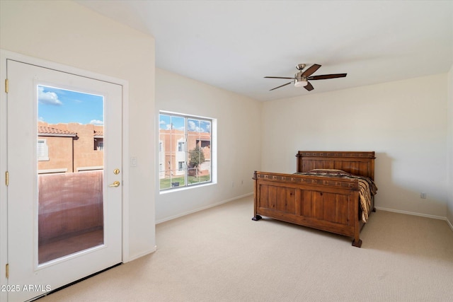 bedroom with ceiling fan and light carpet