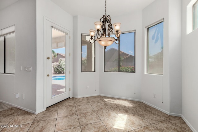 2425 W Red Range Way, Phoenix, AZ 85085 - unfurnished dining area with a chandelier and tile patterned floors